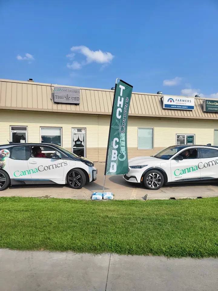 Canna Corners storefront and branded vehicles outside a Minnesota retail location